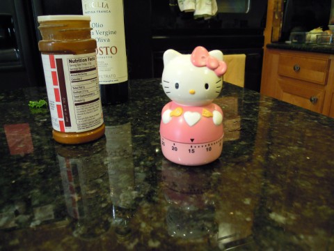 Hello Kitty timer says "15 minutes, then turn the chips"